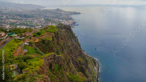Madeira - Viewpoint Cabo Girao with view to the City of Funchal and green meadows above the ocean