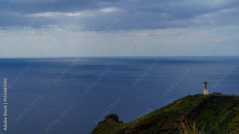 Madeira - Garajau with statue of jesus christ Christo Rei before endless blue ocean