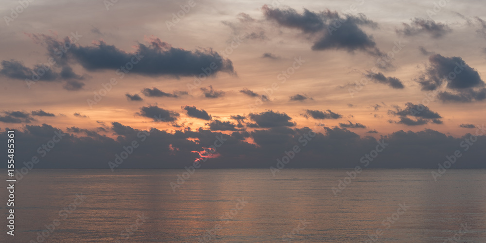 Sunrise on the sea. Early morning on the Gulf of Thailand in Prachuap Phiri Khan. The view from the main pier of the city