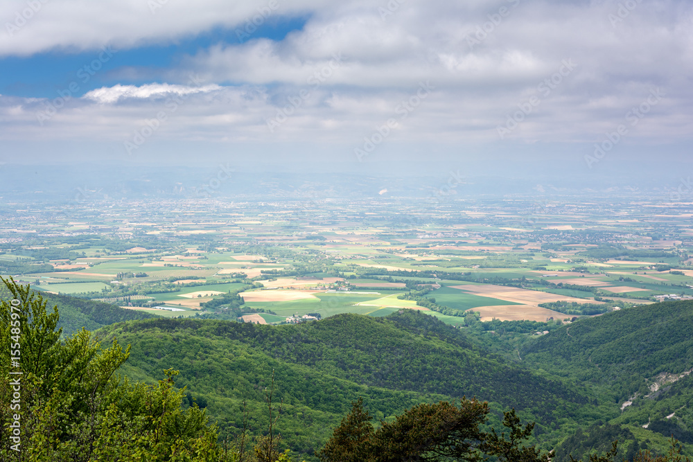 French countryside. View over the Rhone Valley with its fields and the Ardeche in the background.