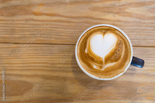 Coffee cup of Cafe' latte with heart latte art on top, top view picture