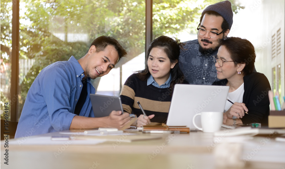 Group of business people having different age in creative business discussing work in the office Group of business people having different age in creative business discussing work in the office