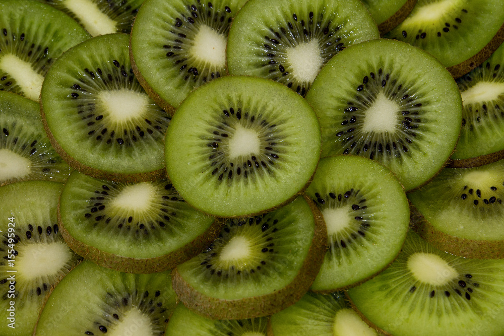 Fresh Kiwi Slices Close-up Background. Fresh Kiwi Slices Close-up Background.