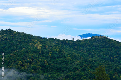 green mountain with blue sky