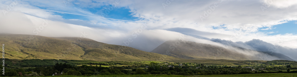 Dramatic sky storm clouds and mist falling on the Dingle peninsula in county Kerry, Ireland