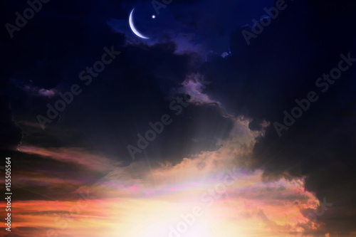 Fototapeta Naklejka Na Ścianę i Meble -   Religion background  .  Sunset or sunrise with clouds, light rays and other atmospheric effect . Red sunset and moon 