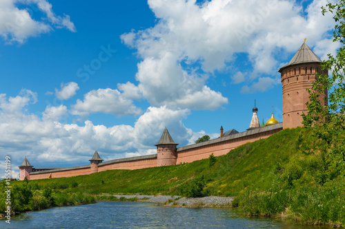 The walls and towers of Spaso-Evfimiev monastery on high Bank of the river in Suzdal