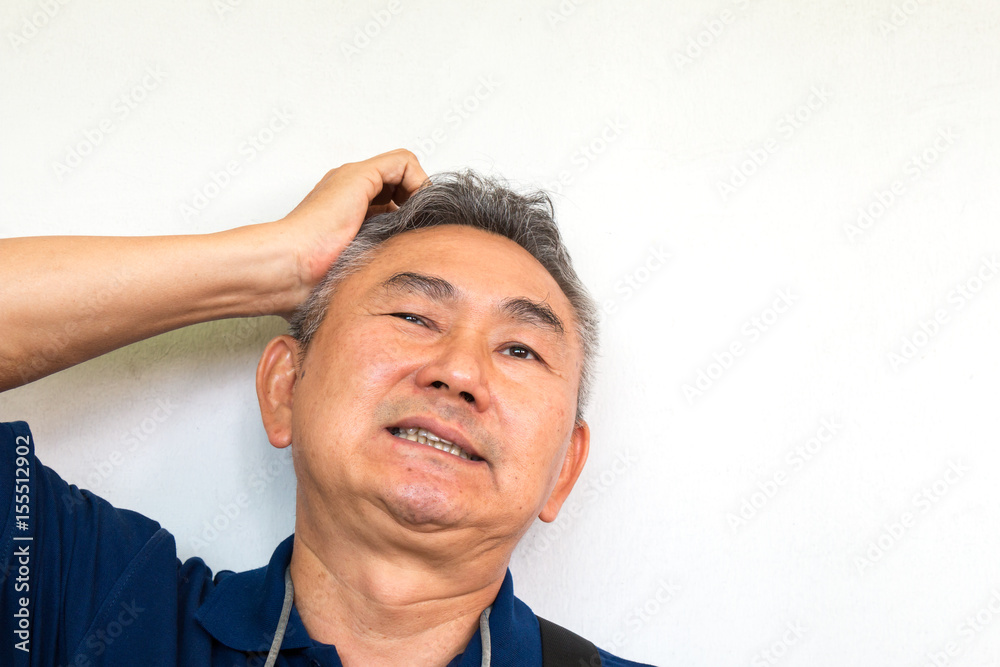 Obraz premium Picture of elderly asian man has a headache