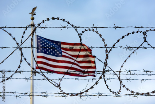 American flag and barbed wire, USA border photo