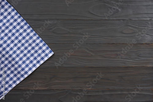 blue cloth on dark wooden background with copy space. Top view.
