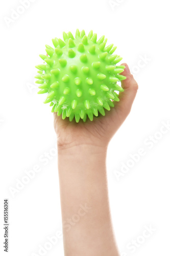 Female hand with stress ball on white background
