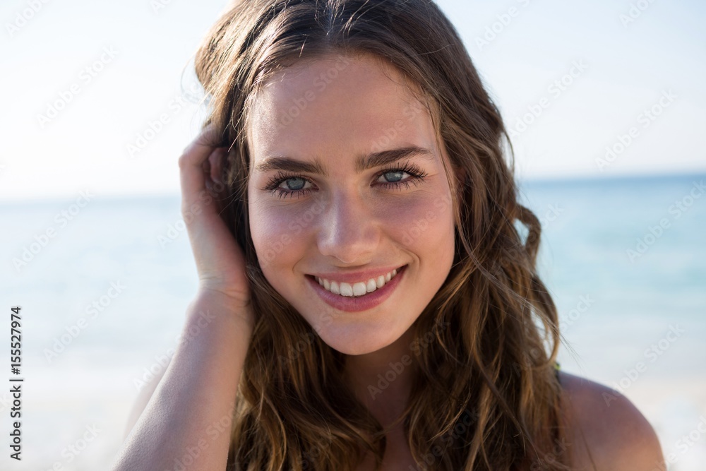 Portrait of smiling beautiful woman at beach