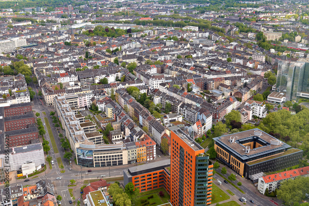 High top view of many roofes of city houses from Dusseldorf Rhine Tower in summer sunny day. Germany