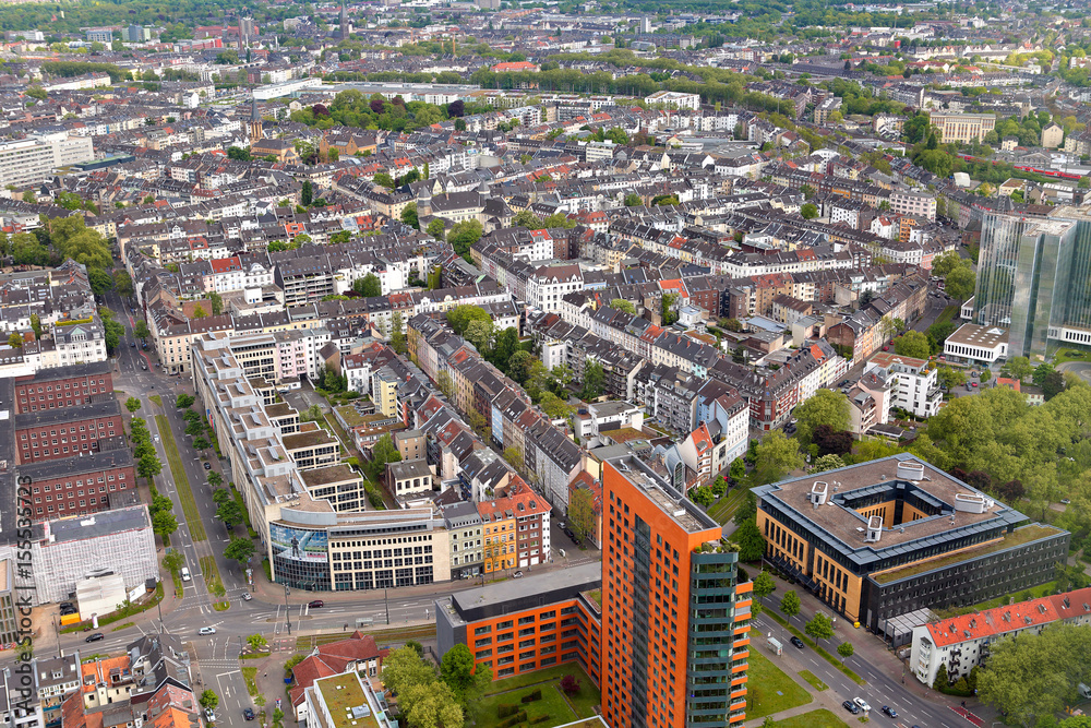 Naklejka premium High top view of many roofes of city houses from Dusseldorf Rhine Tower in summer sunny day. Germany