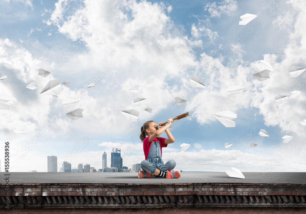 Concept of careless happy childhood with girl exploring this world Concept of careless happy childhood with girl exploring this world