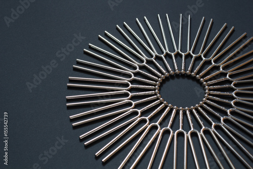 Tuning fork round pattern on a black background