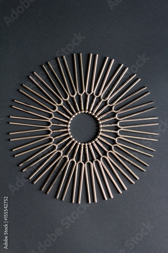Tuning fork round pattern on a black background