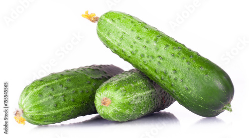.vitamin harvest of vegetables from three cucumber, pickle, gherkin with green sprigs of fresh isolated on white background