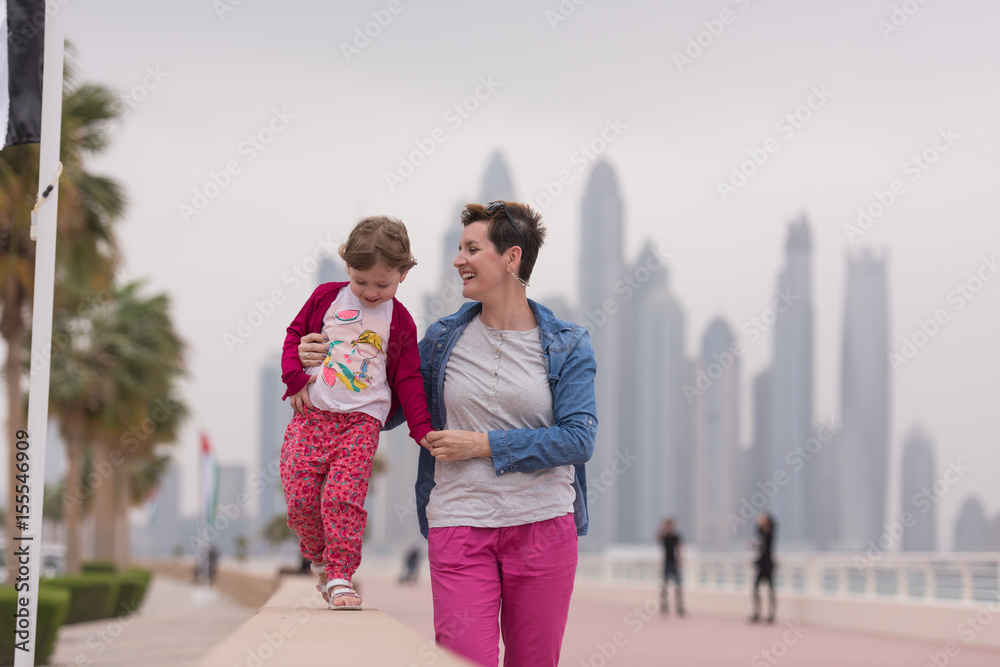 mother and cute little girl on the promenade mother and cute little girl on the promenade