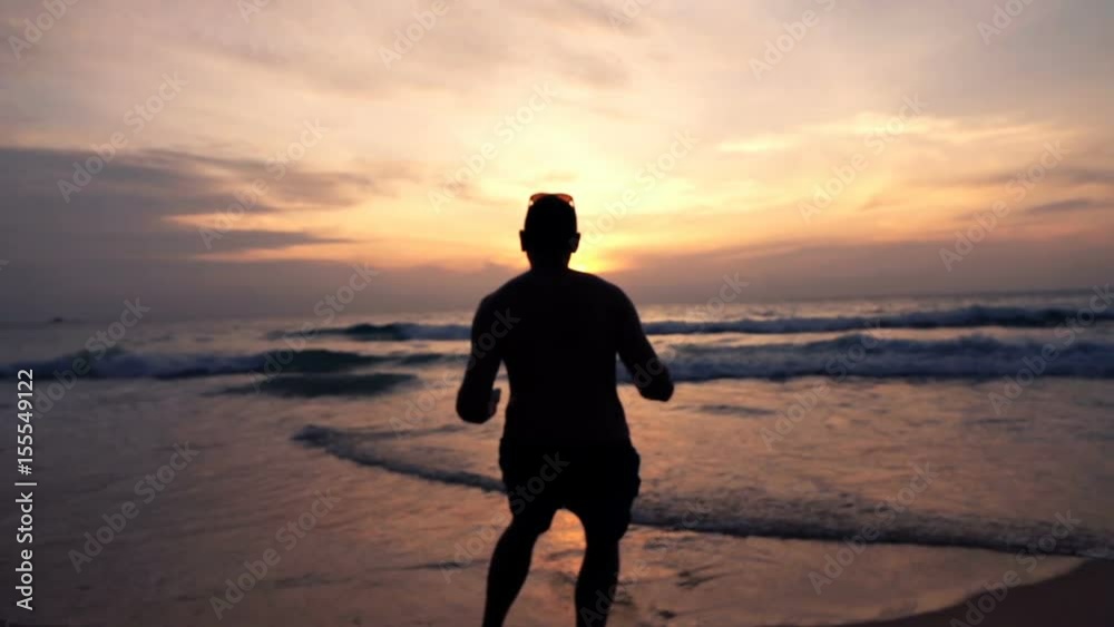 Happy man jumping on beach during sunset, super slow motion 240fps
Happy man jumping on beach during sunset, super slow motion 240fps