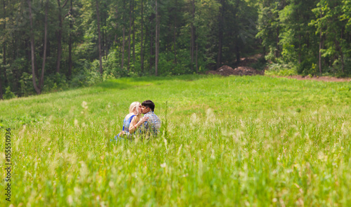 Young kissing couple against the nature © satura_