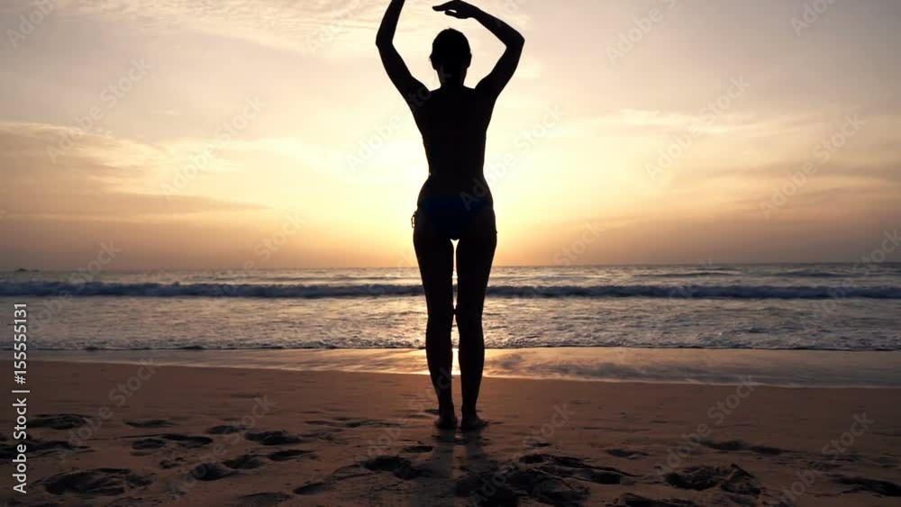 Silhouette of woman in bikini stretching arms during sunset on beach, super slow motion 240fps
Silhouette of woman in bikini stretching arms during sunset on beach, super slow motion 240fps