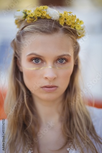 Portrait of woman wearing flowers