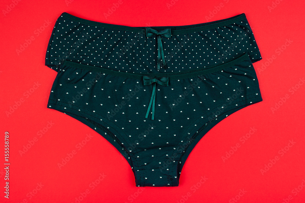 Women's cotton panties flowered isolated on red background. Women's cotton panties flowered isolated on red background.