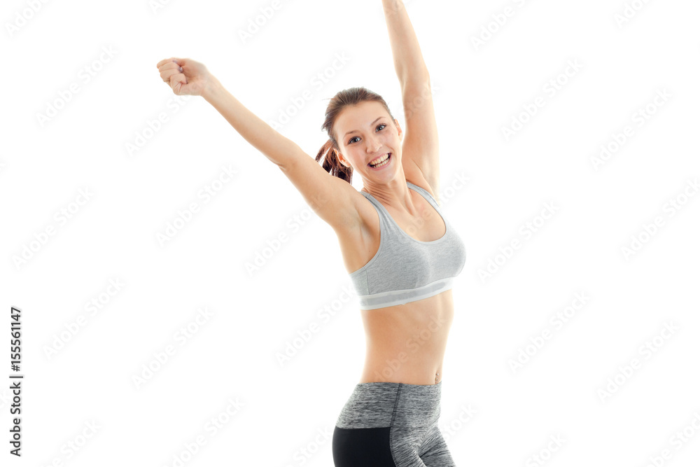 fun energetic girl in grey top with beautiful breasts laughs and raises her hands up fun energetic girl in grey top with beautiful breasts laughs and raises her hands up