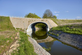 Culvert - drain under road for small river. Big pipe under freeway, highway engineering; roadmaking - Poland , Dabrowka Malborska