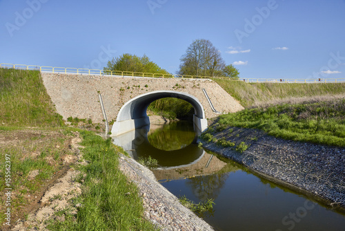 Culvert - drain under road for small river. Big pipe under freeway, highway engineering; roadmaking - Poland , Dabrowka Malborska