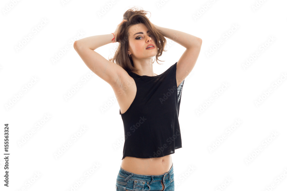 beautiful young girl in the black shirt keeps hair hands and erotic looks at camera beautiful young girl in the black shirt keeps hair hands and erotic looks at camera