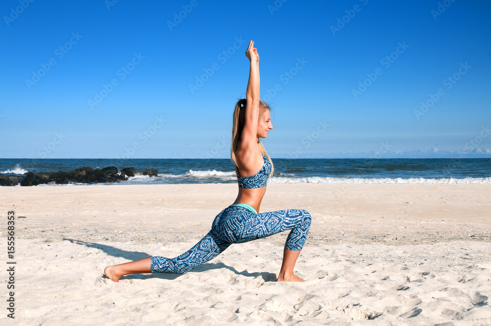 Yoga outdoors - woman practicing yoga at beach Yoga outdoors - woman practicing yoga at beach