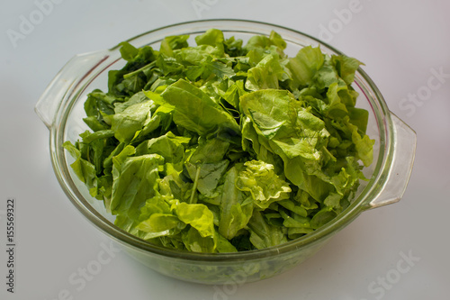 Lettuce and green salad in the bowl on the table