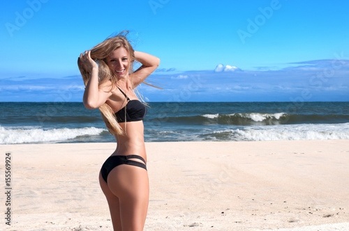 Sexy woman relax on the summer beach. Vacation at Paradise.