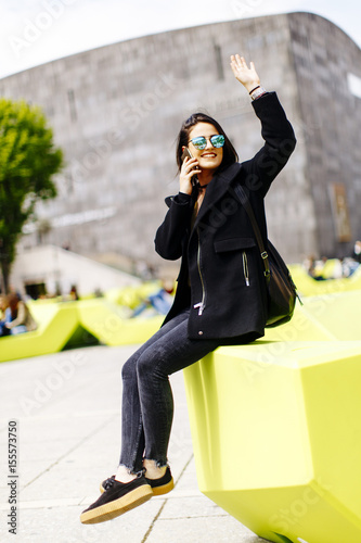 Young woman sitting in the ...