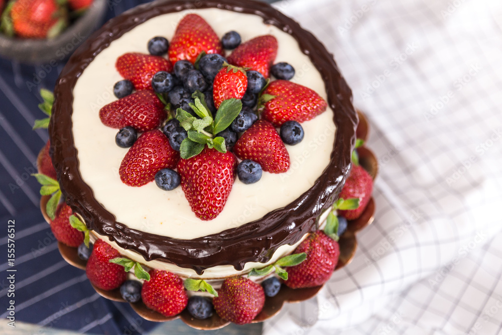 Sour cream cake decorated with berries Sour cream cake decorated with berries