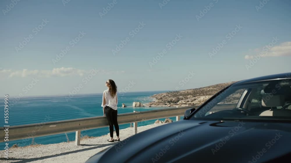 The woman enjoy the beautiful landscape with blue ocean The woman enjoy the beautiful landscape with blue ocean