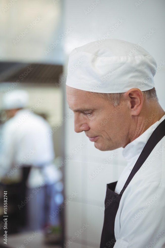 Chef preparing food in the commercial kitchen