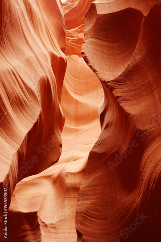 Nature red sandstone textured background Swirls of old red sandstone wall abstract pattern in Lower Antelope Canyon, Page, Arizona, USA.