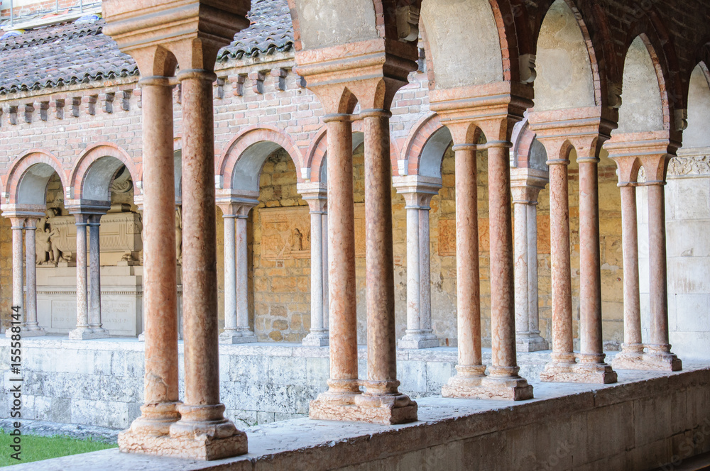 The medieval colonnade of the inner courtyard of Basilica of San Zeno in Verona, Italy