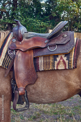 Fototapeta Naklejka Na Ścianę i Meble -  Western saddle for a horse decorated with beautiful ornament