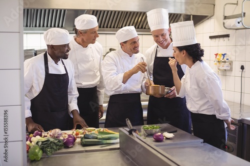 Team of chef tasting food in the commercial kitchen