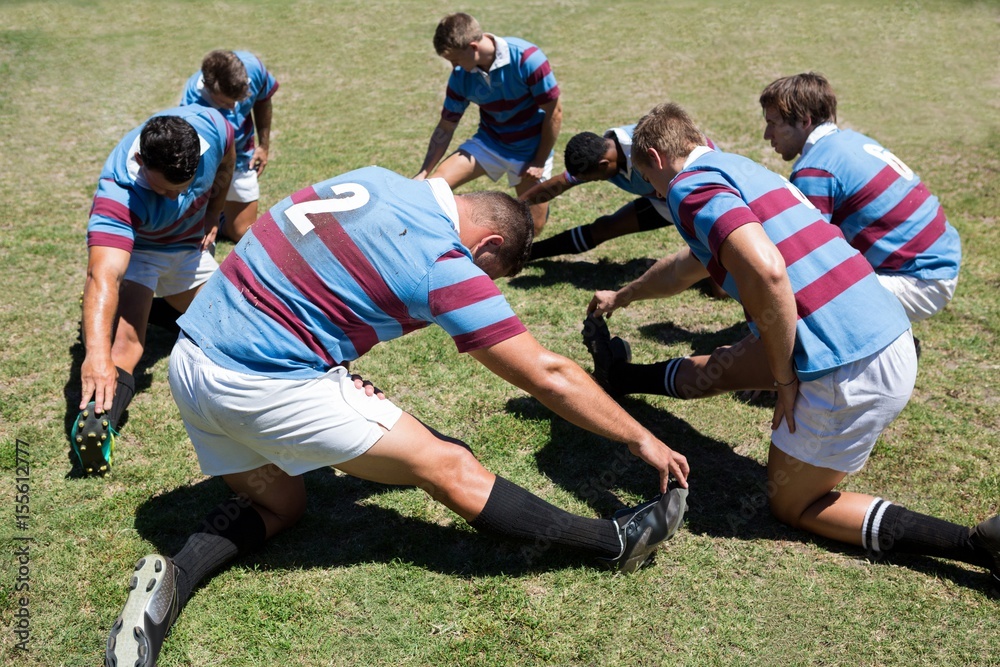 High angle view of rugby players exercising High angle view of rugby players exercising