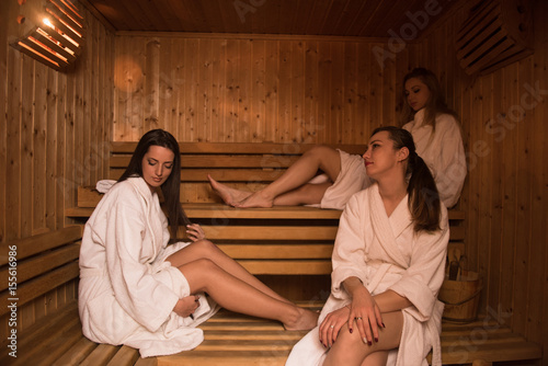 a group of young women in a sauna