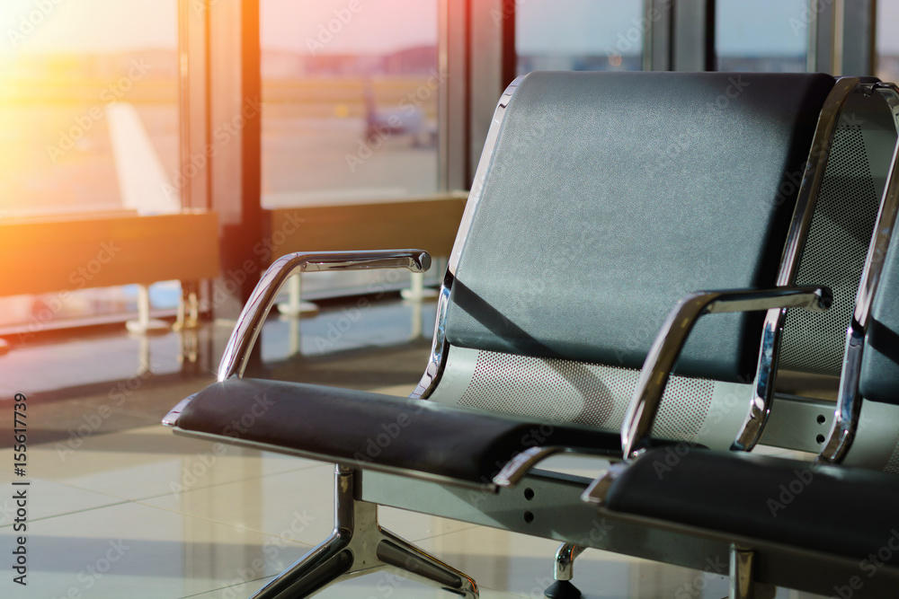 Passenger seat in Departure lounge of airport Passenger seat in Departure lounge of airport