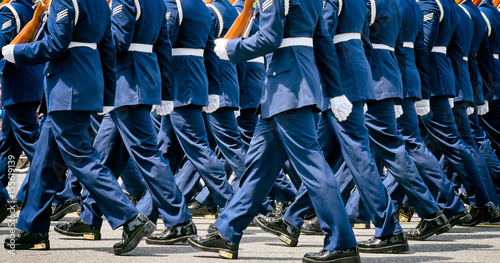 Konstfotografi US soldiers in blue dress uniforms march in a Memorial Day parade