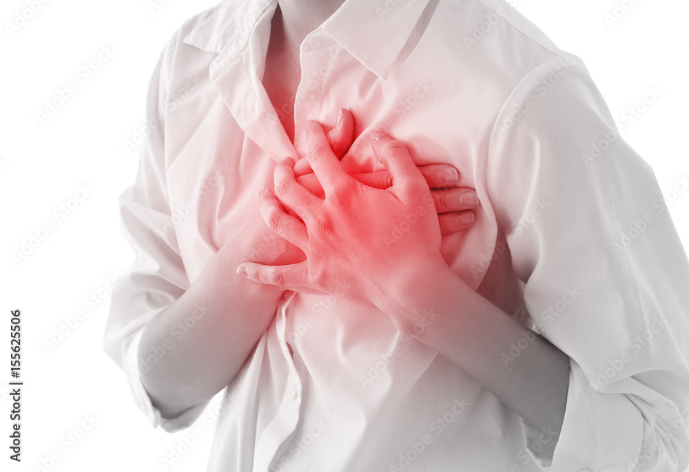 Heart attack concept. Young woman suffering from chest pain on white background Heart attack concept. Young woman suffering from chest pain on white background