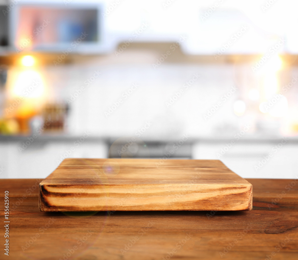 Wooden board on kitchen table at home