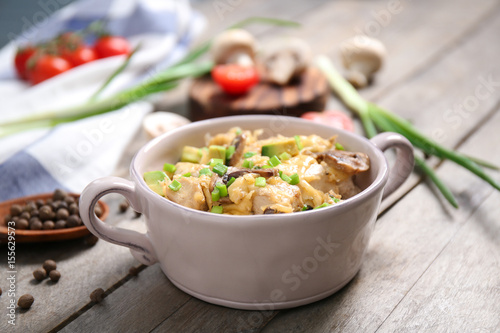 Delicious chicken casserole meal in saucepan on table